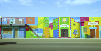 A painted wall of colorful houses.